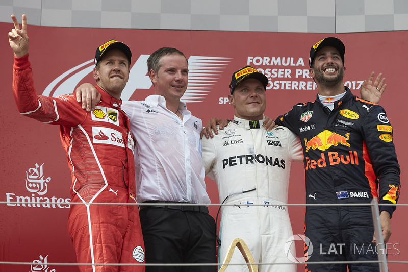 Second place Sebastian Vettel, Ferrari, Race winner Third place Valtteri Bottas, Mercedes AMG F1 Dan