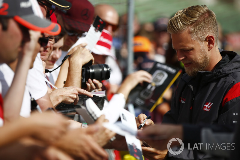 Kevin Magnussen, Haas F1 Team, signs autographs for fans