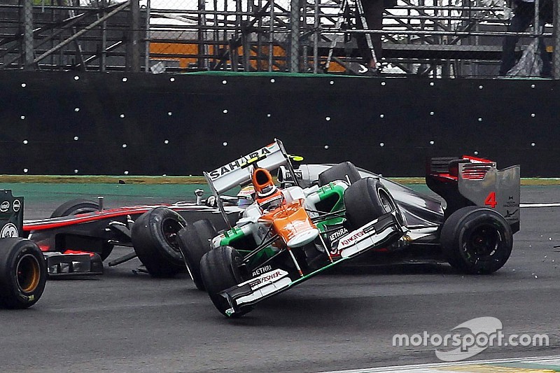 Nico Hulkenberg, Sahara Force India F1 and Lewis Hamilton, McLaren crash battling for the lead of th