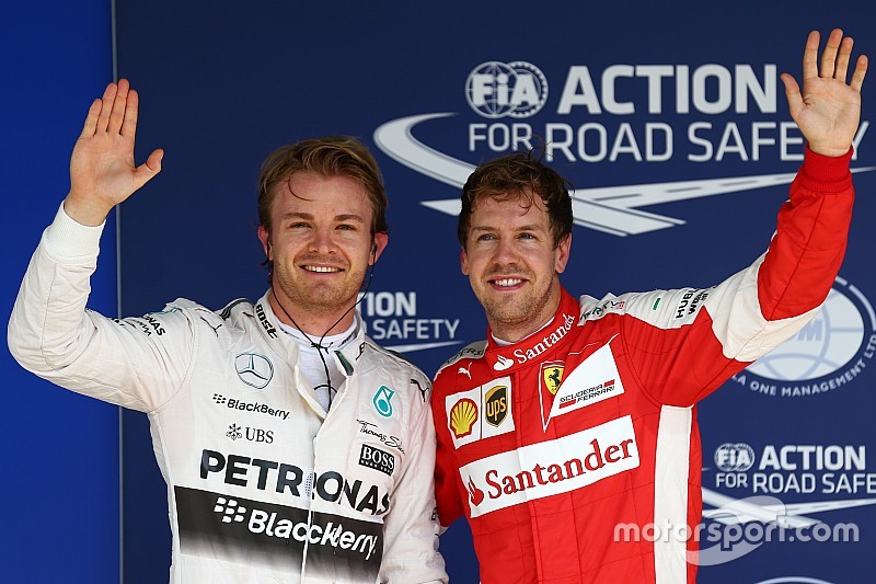 Gnador de la pole  Nico Rosberg, Mercedes AMG F1 W06 y el tercer lugar Sebastian Vettel, Ferrari SF1