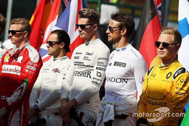 Nico Hulkenberg, Sahara Force India F1 and Jenson Button, McLaren as the grid observes the national anthem