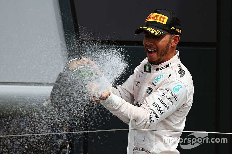 Race winner Lewis Hamilton, Mercedes AMG F1 celebrates with the champagne on the podium