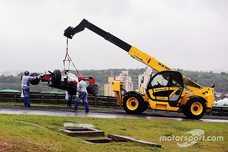 The Haas VF-16 of Romain Grosjean, Haas F1 Team is removed from the circuit after he crashed heading to the grid