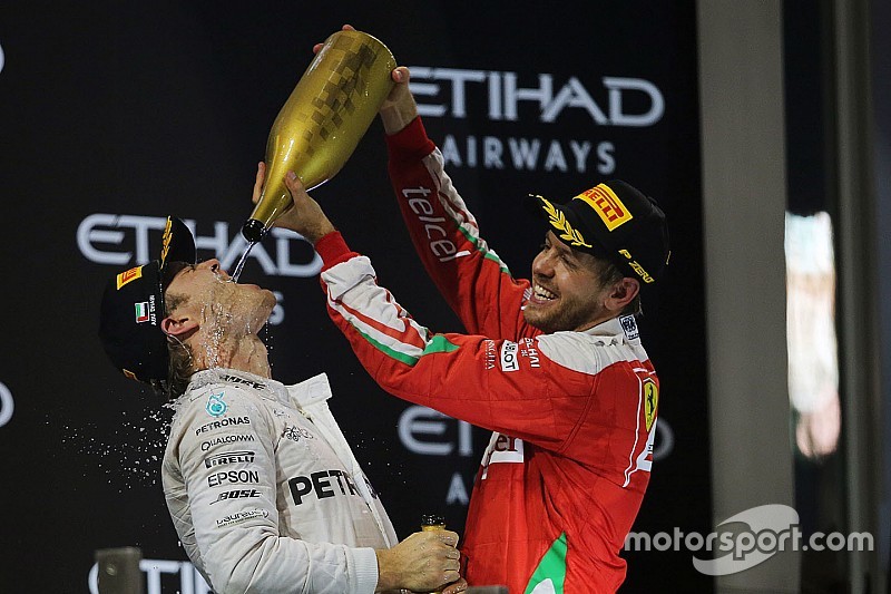 Second place Nico Rosberg, Mercedes AMG F1 celebrates his World Championship on the podium with Seba