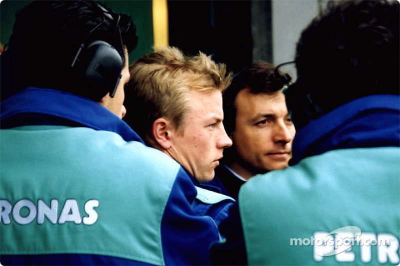 Kimi Raikonnen with his team