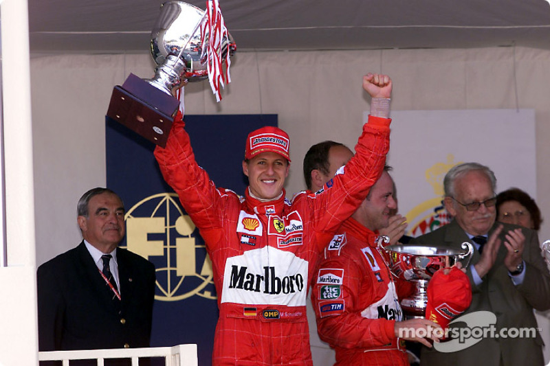 Michael Schumacher and Rubens Barrichello on the podium with the Prince Rainier