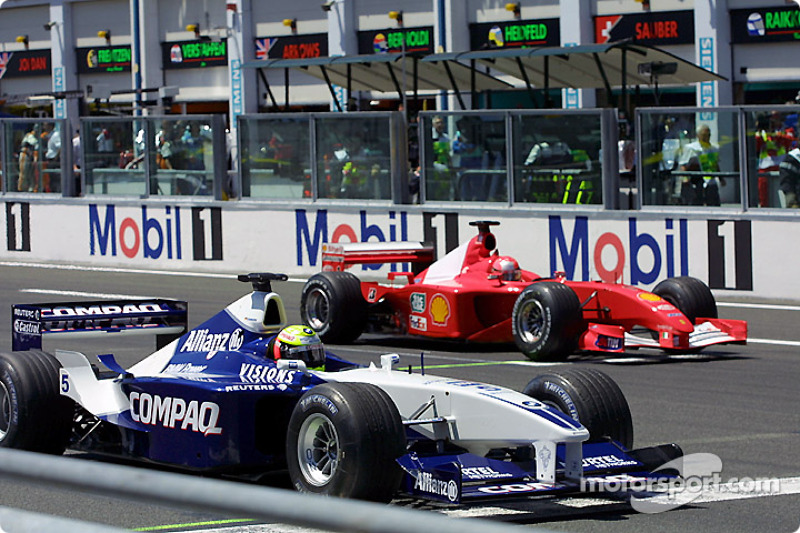 On the starting grid: Michael Schumacher looking at brother Ralf