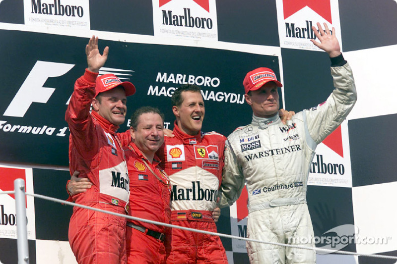 The podium: Rubens Barrichello, Jean Todt, Michael Schumacher and David Coulthard