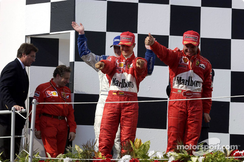 The podium: race winner Rubens Barrichello with Michael Schumacher and Ralf Schumacher