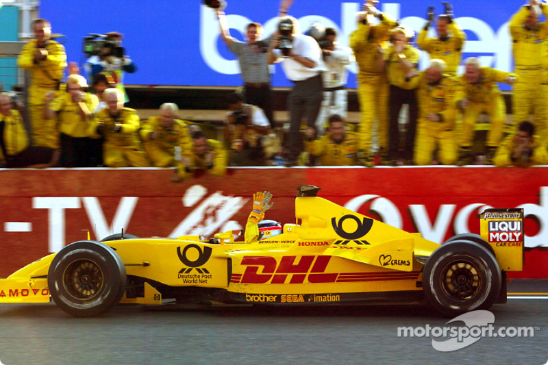 Takuma Sato celebrates his first points in Formula 1