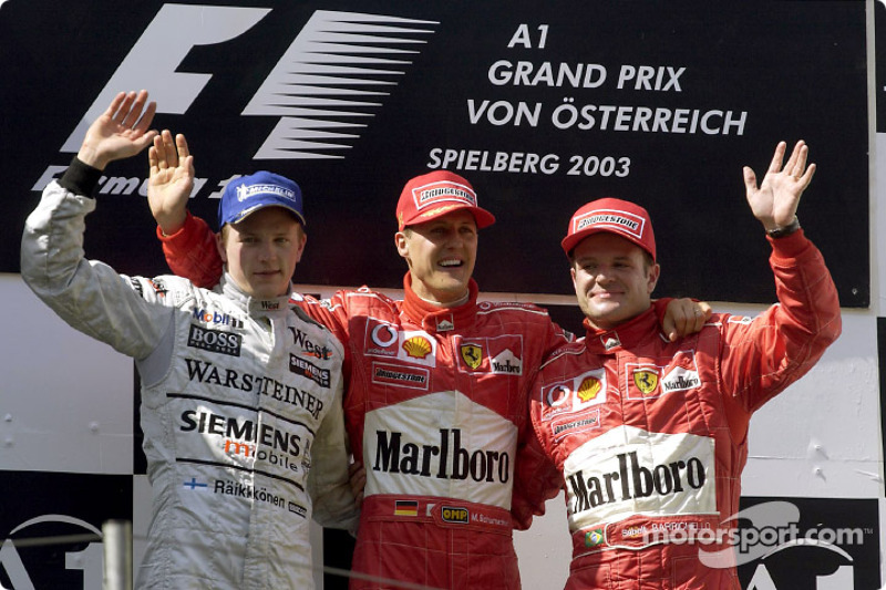 Podium: winnaar Michael Schumacher met Kimi Raikkonen en Rubens Barrichello