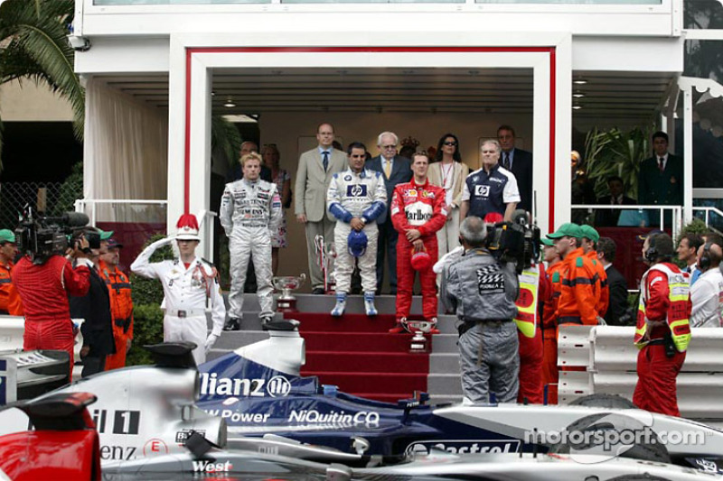 The podium: race winner Juan Pablo Montoya with Kimi Raikkonen and Michael Schumacher