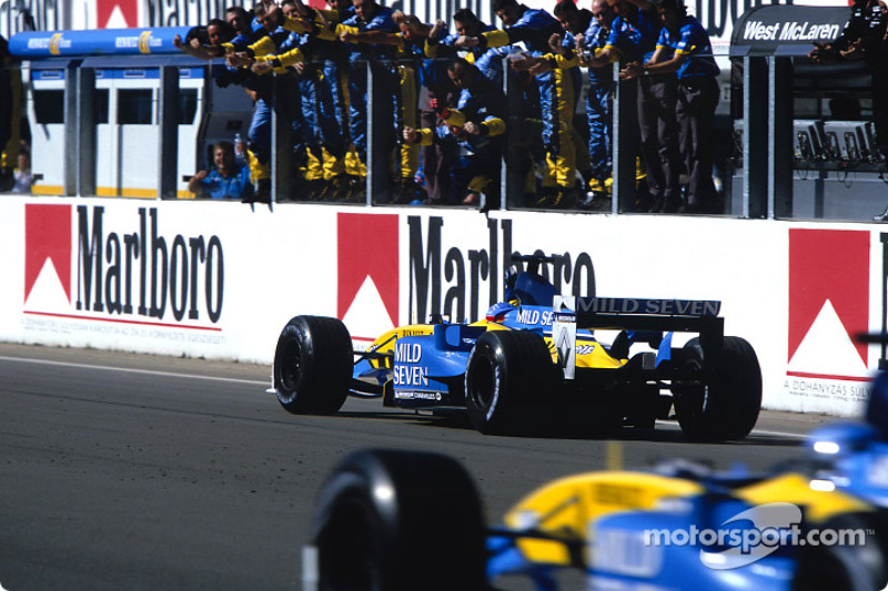 Race winner Fernando Alonso celebrates