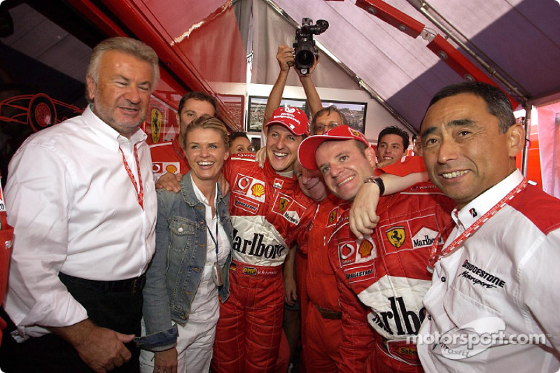 Race winner Michael Schumacher celebrate with Willi Webber, wife Corinna, Jean Todt and Rubens Barrichello