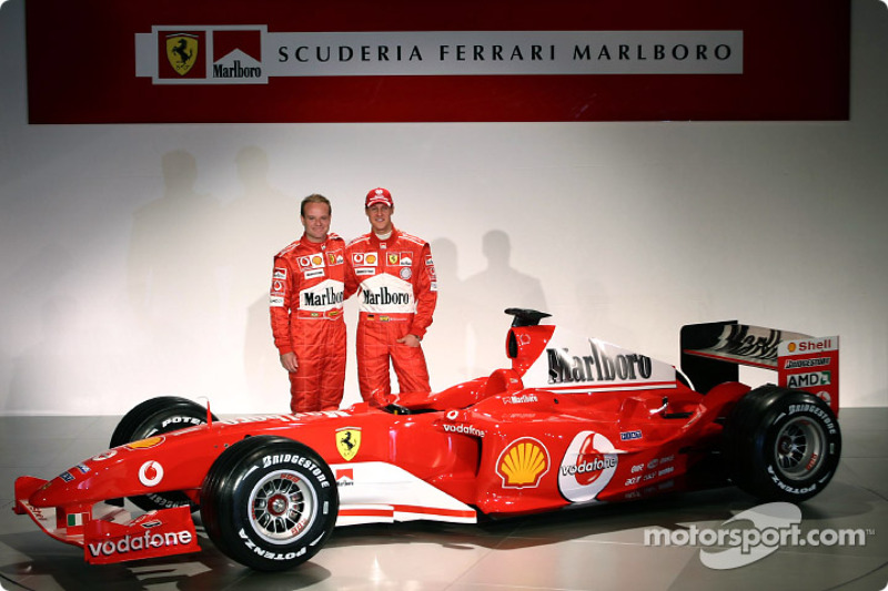Rubens Barrichello and Michael Schumacher with the new Ferrari F2004
