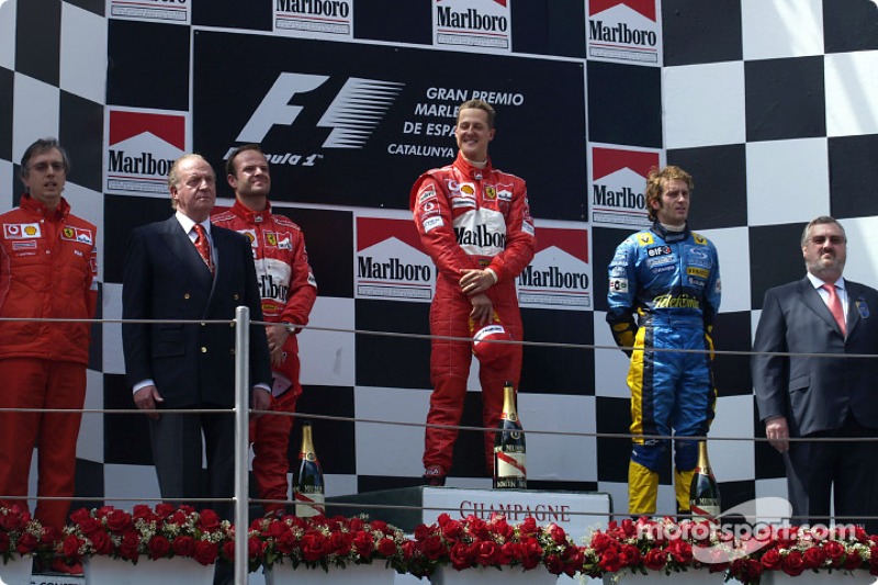 Podium: race winner Michael Schumacher with Rubens Barrichello and Jarno Trulli