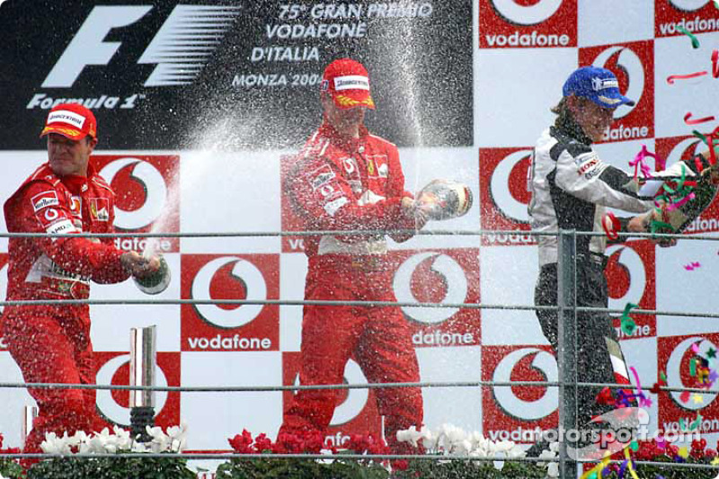 Podium: champagne for Rubens Barrichello, Michael Schumacher and Jenson Button