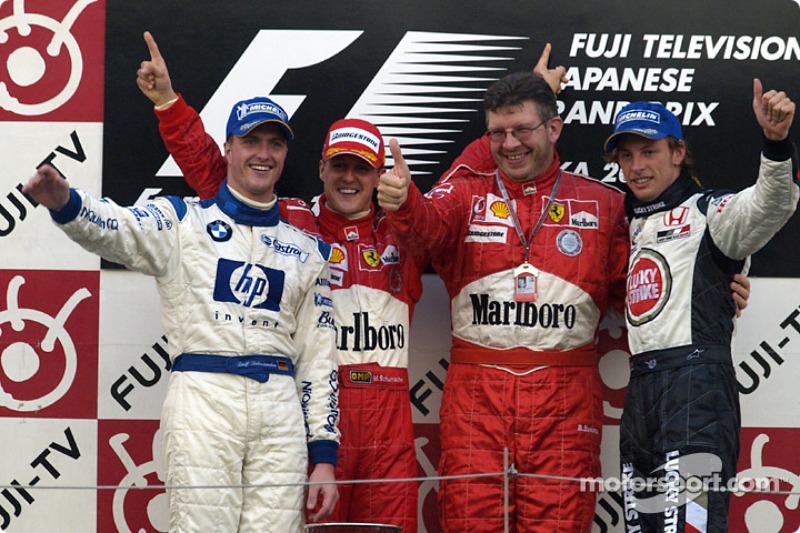 Podium: race winner Michael Schumacher with Ralf Schumacher, Ross Brawn and Jenson Button