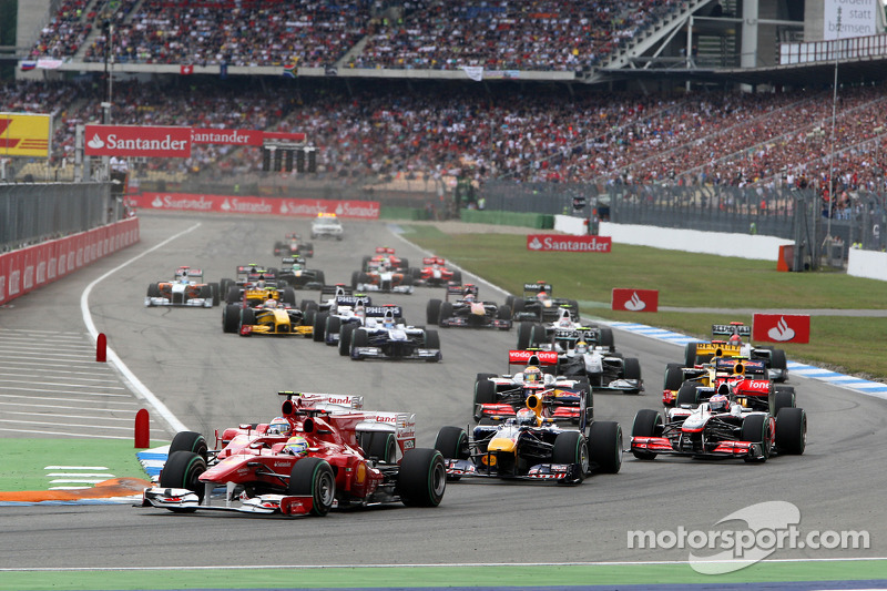 Felipe Massa, Scuderia Ferrari leads Fernando Alonso, Scuderia Ferrari and Sebastian Vettel, Red Bul