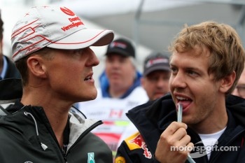 Michael Schumacher, Mercedes GP Petronas and Sebastian Vettel, Red Bull Racing