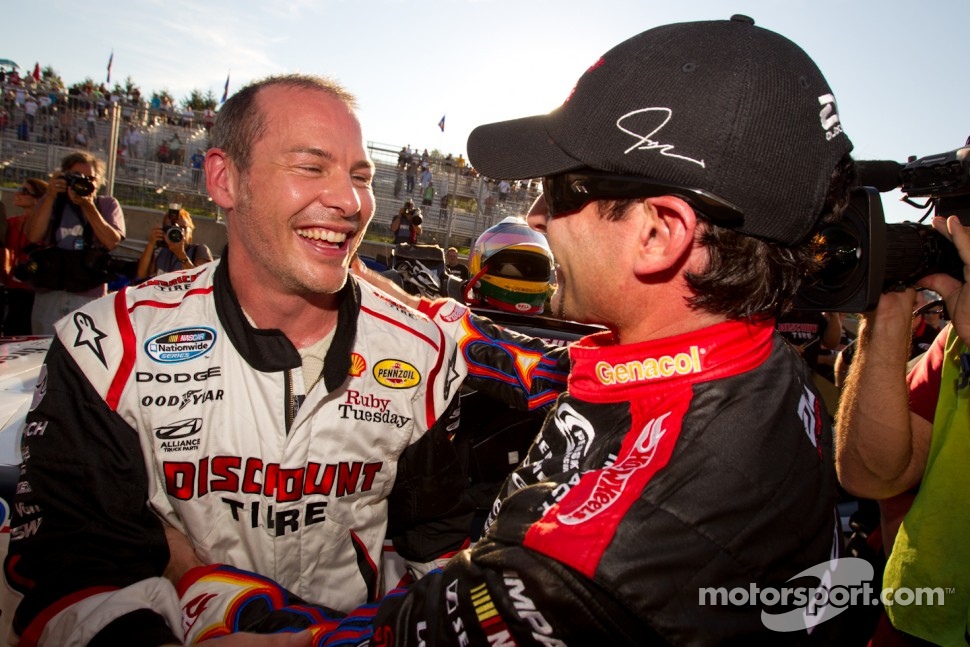 Pole winner Jacques Villeneuve, Penske Racing Dodge celebrates with second place Alex Tagliani, Penske Racing Dodge