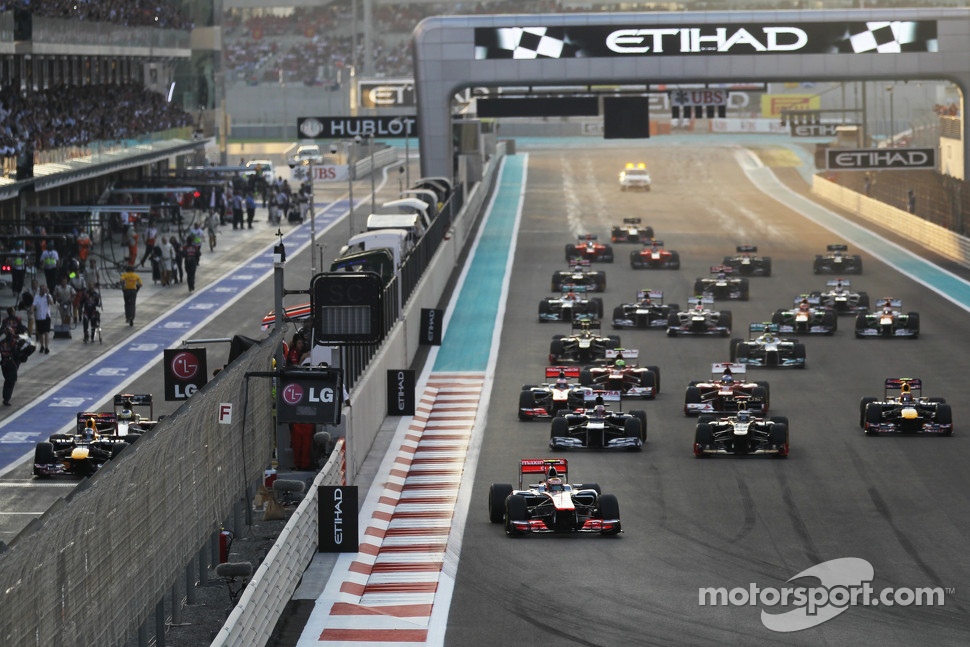 Lewis Hamilton, McLaren leads at the start of the race with Sebastian Vettel, Red Bull Racing and Pedro De La Rosa, HRT Formula 1 Team F112 starting from the pit lane