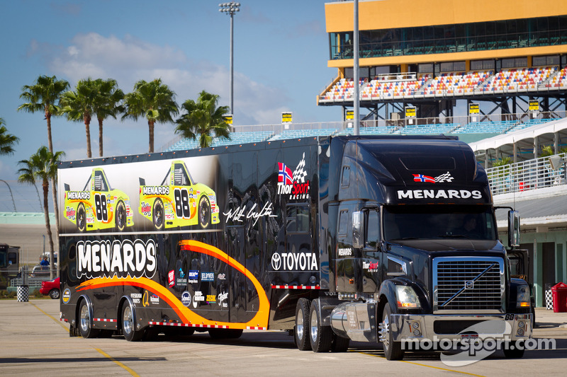 NASCAR Camping World Truck Series haulers enter the garage area at