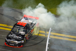 Race winner Johnny Sauter celebrates