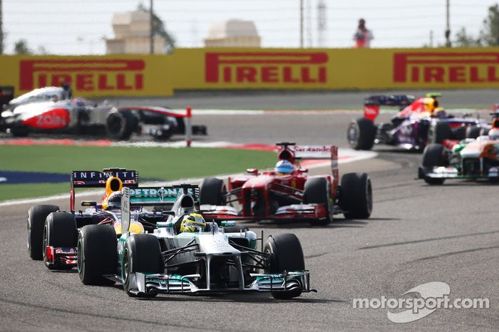 Nico Rosberg, Mercedes AMG F1 W04 leads Sebastian Vettel, Red Bull Racing RB9 and Fernando Alonso, Ferrari F138