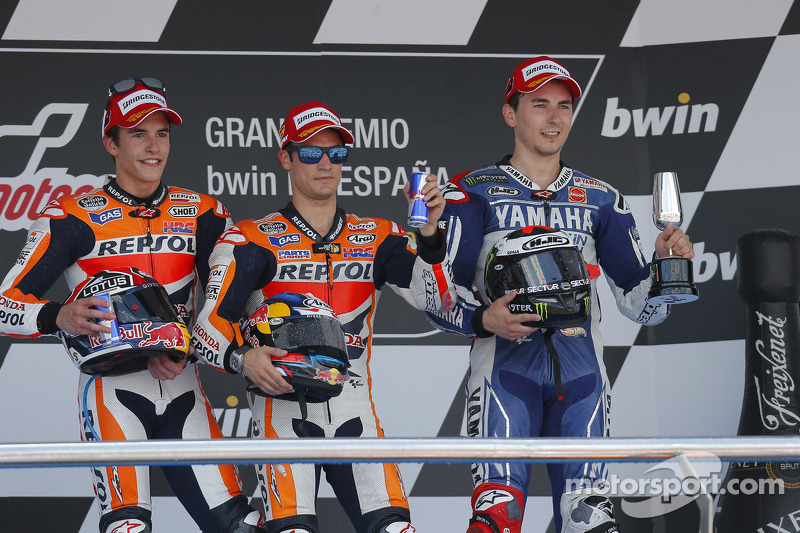 Podium 2013: posisi kedua Marc Marquez, Repsol Honda Team, pemenang balapan Dani Pedrosa, Repsol Honda Team, peringkat ketiga Jorge Lorenzo, Yamaha Factory Racing