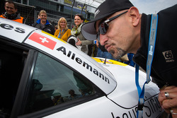 Alex Wesselsky, Cyndie Allemann's co-host on the TV show Auftrag Auto, has fun on the starting gri