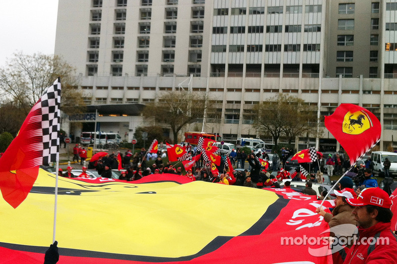 Ferrari fans show support for Michael Schumacher in front of the Grenoble University Hospital follow