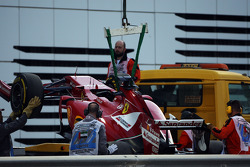 The Ferrari F14-T of Fernando Alonso, Ferrari is recovered back to the pits on the back of a truck