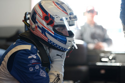 Joey Hand watches as his car is repaired