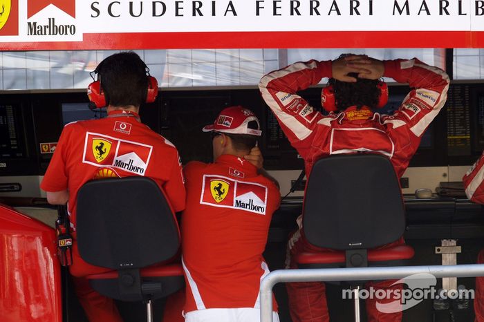 Michael Schumacher watches the end of the race at pitwall