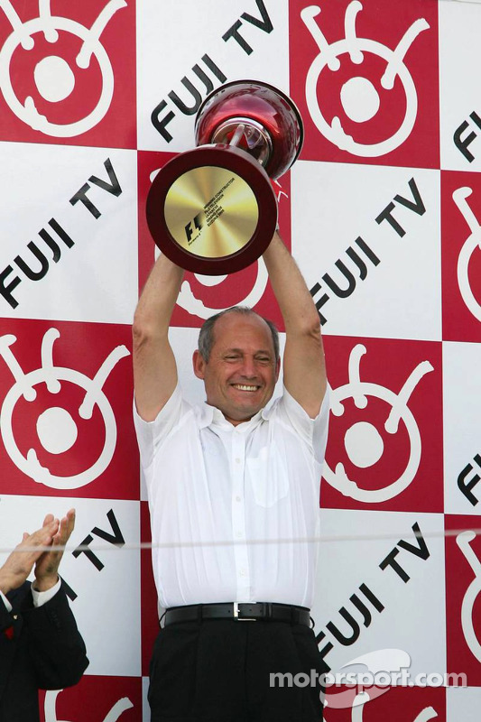 Podium: Ron Dennis accepts the constructors trophy