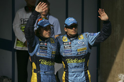 Pole winner Fernando Alonso celebrates with Giancarlo Fisichella
