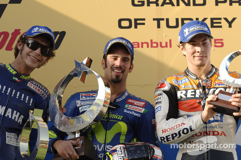 Podium: race winner Marco Melandri with Valentino Rossi and Nicky Hayden