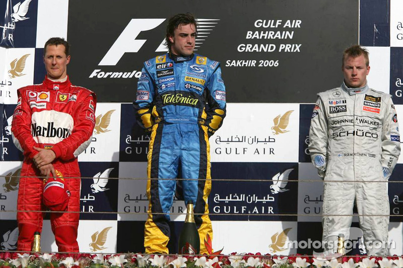 Podium: race winner Fernando Alonso with Michael Schumacher and Kimi Raikkonen