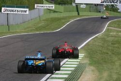 Fernando Alonso chases Michael Schumacher