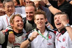 Race winner Jenson Button celebrates with Rubens Barrichello, Anthony Davidson and Honda Racing F1 team members