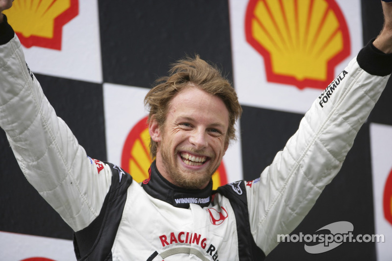 Podium: race winner Jenson Button celebrates