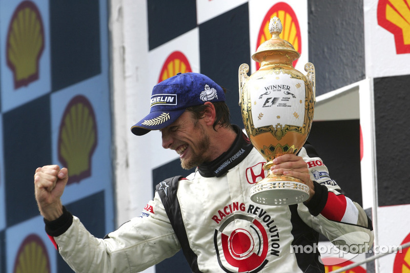 Podium: race winner Jenson Button celebrates