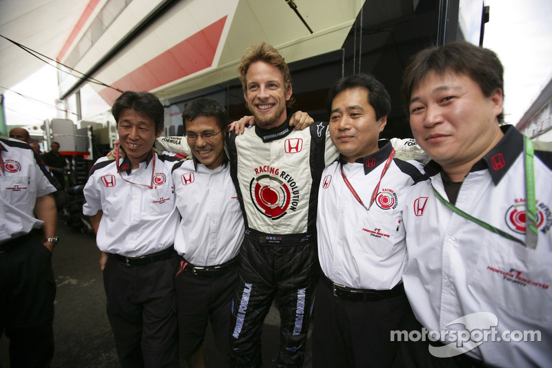 Race winner Jenson Button celebrates with Honda Racing F1 team members