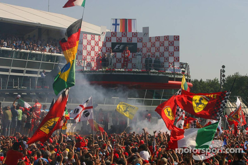 Podium: race winner Michael Schumacher with Kimi Raikkonen and Robert Kubica