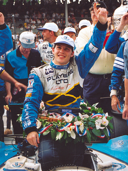 Race winner Jacques Villeneuve celebrates