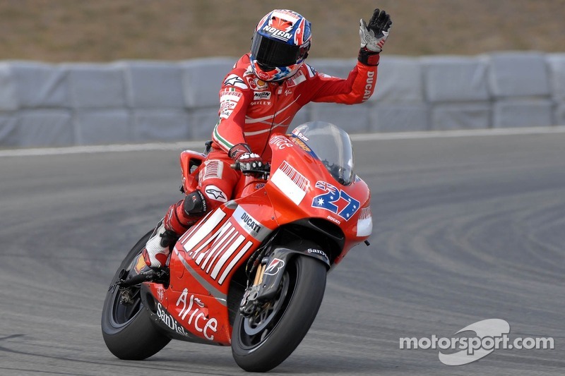 Race winner Casey Stoner celebrates