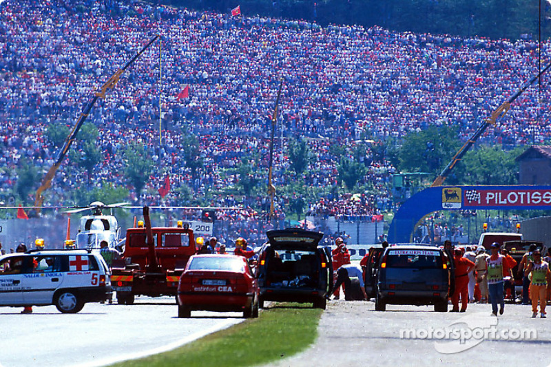 The fatal crash of Ayrton Senna at Tamburello: safety team members at work