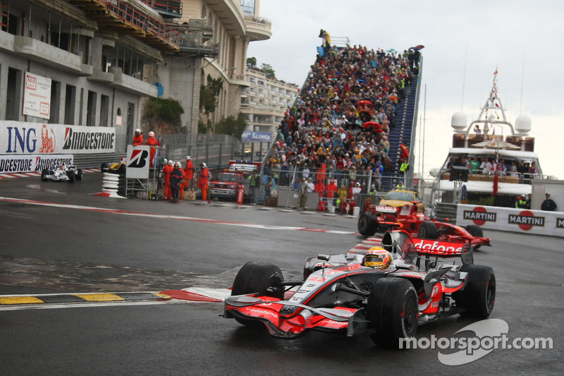 Lewis Hamilton, McLaren Mercedes, MP4-23 and Kimi Raikkonen, Scuderia Ferrari, F2008