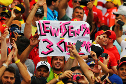 A banner for Lewis Hamilton, Mercedes AMG F1 from fans at the podium